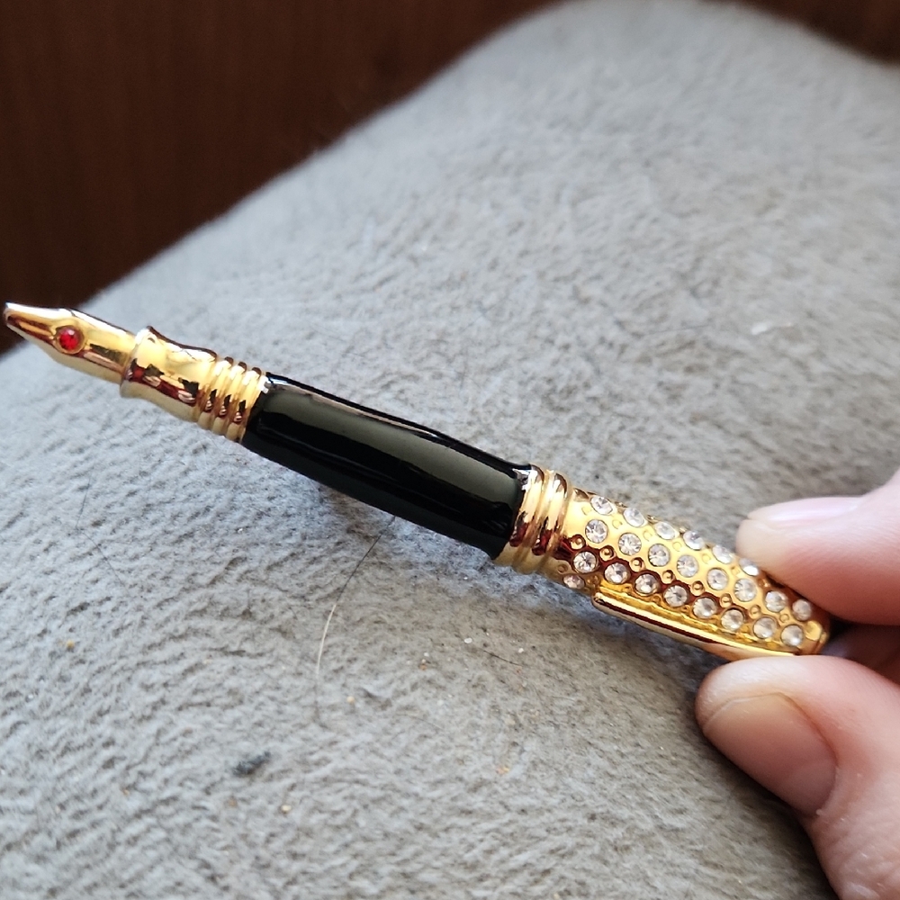 Source Unknown Black and Gold Brooch